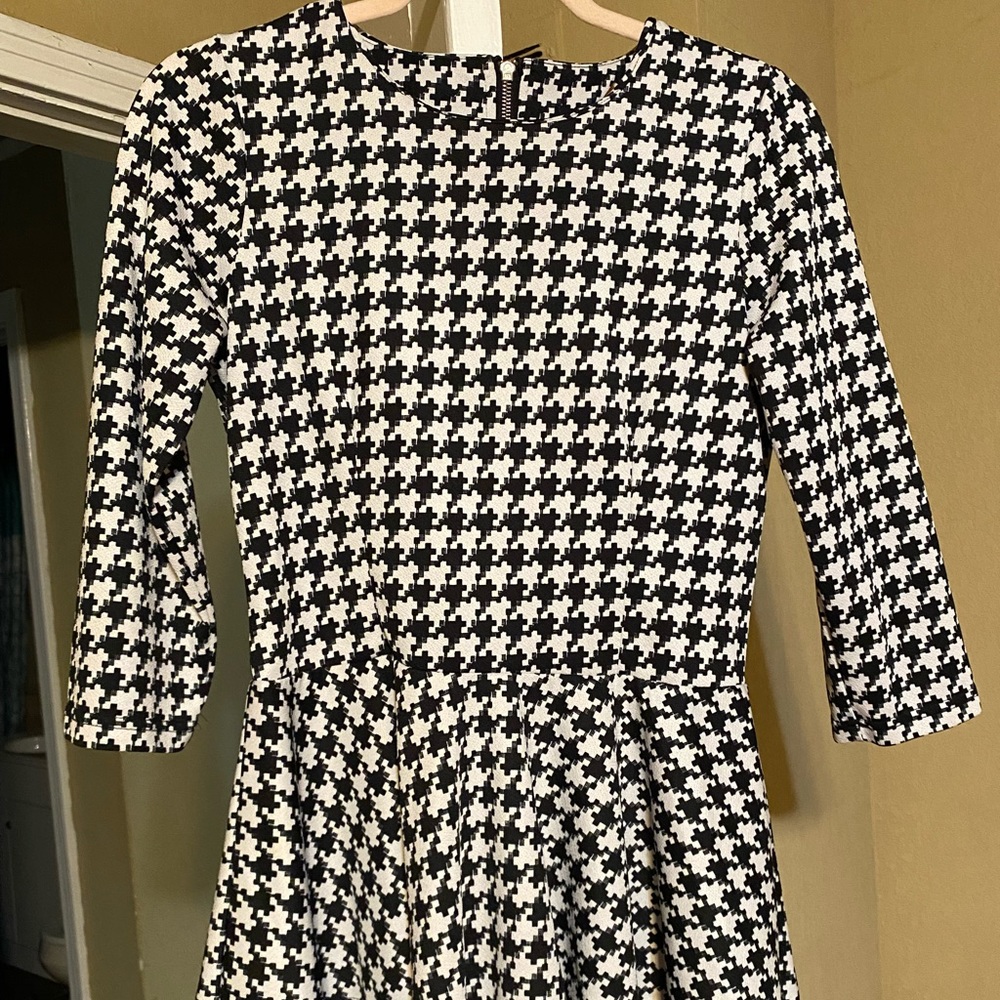 Nuggles’ Houndstooth Peplum Top